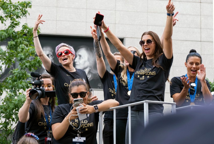 Members of the U.S. women’s soccer team, including Megan Rapinoe, rear left, and Alex Morgan, right foreground, stand on a float before being honored with a ticker tape parade along the Canyon of Heroes in New York, Wednesday, July 10, 2019. The U.S. national team beat the Netherlands 2-0 to capture a record fourth Women’s World Cup title. (AP Photo/Craig Ruttle)